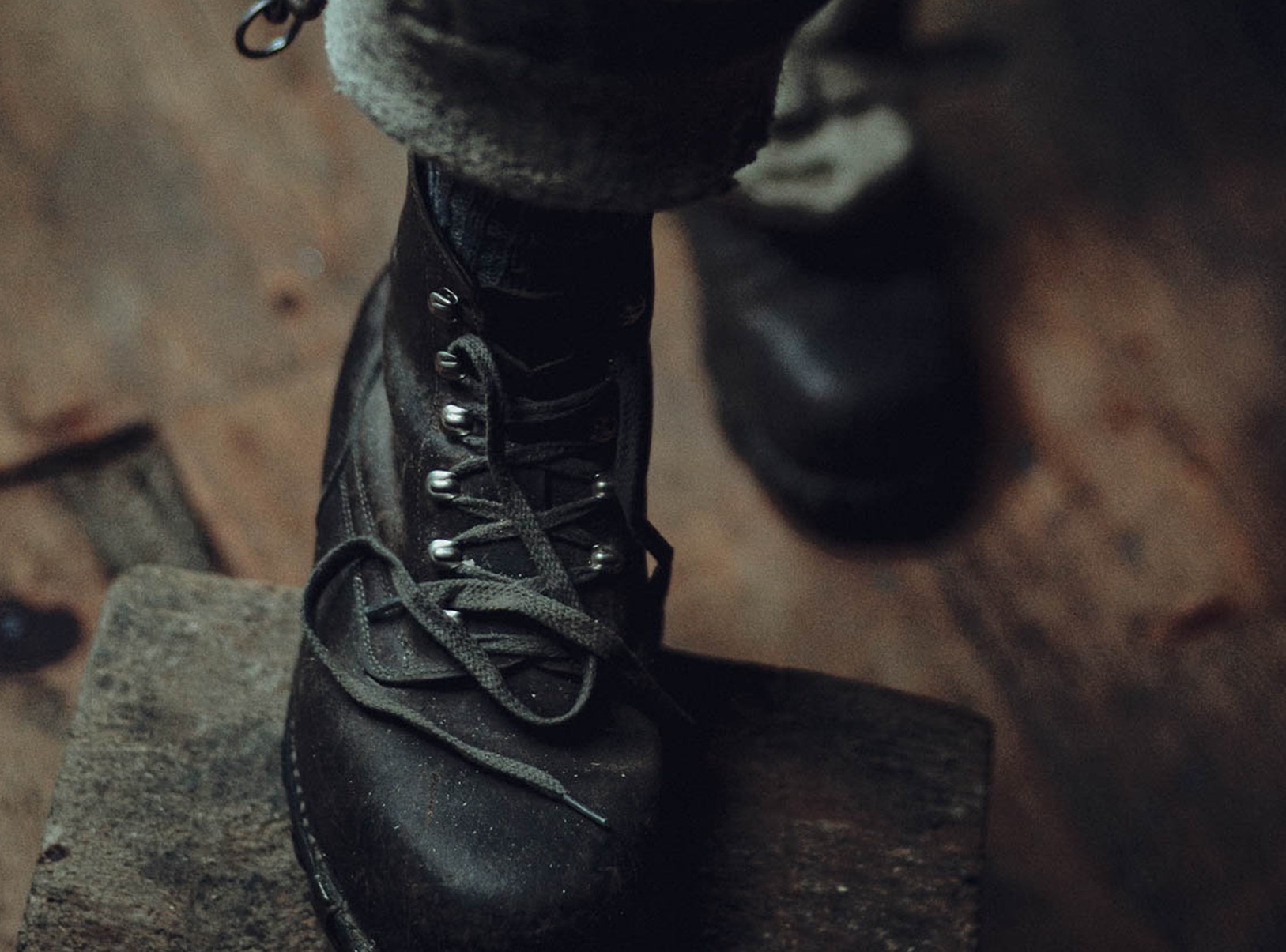 Boot placed on wooden block Simon Abele